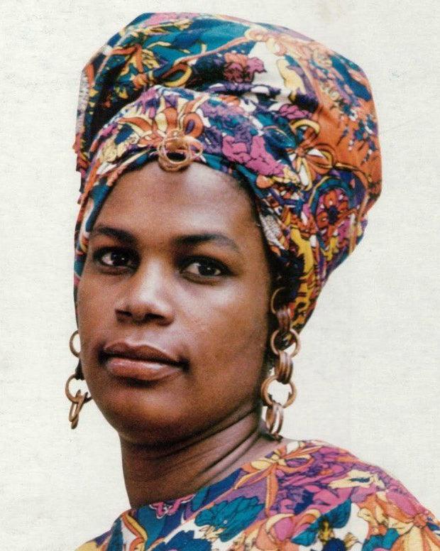 A woman wearing a headwrap